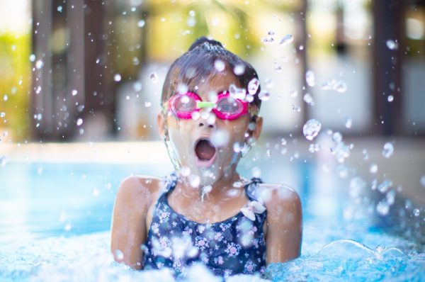 Girl splash in pool
